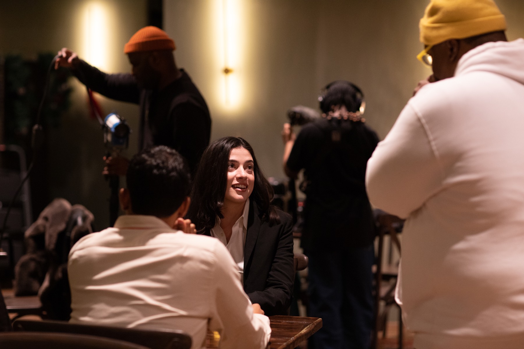 Behind-the-scenes image from Everything Is Fake showing a scene at a table during production.